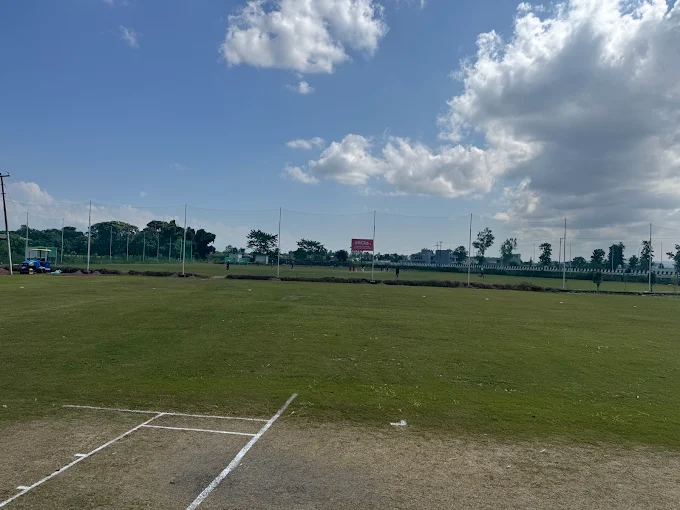 Cricket ground with players on field at Sidh Cricket Academy
